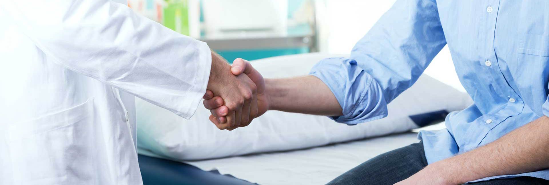 Doctor shaking hands with a patient